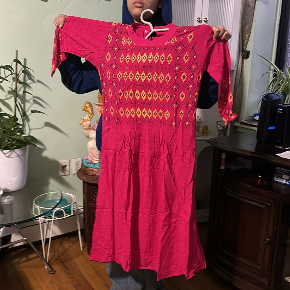 It is small for me. Indian Kurti, bright pink color with printed design 3/4 slee